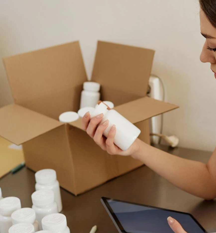 A woman checking the bottle of her product